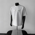 Men's loose fit short sleeve cotton t-shirt with a printed letter pattern in light grey