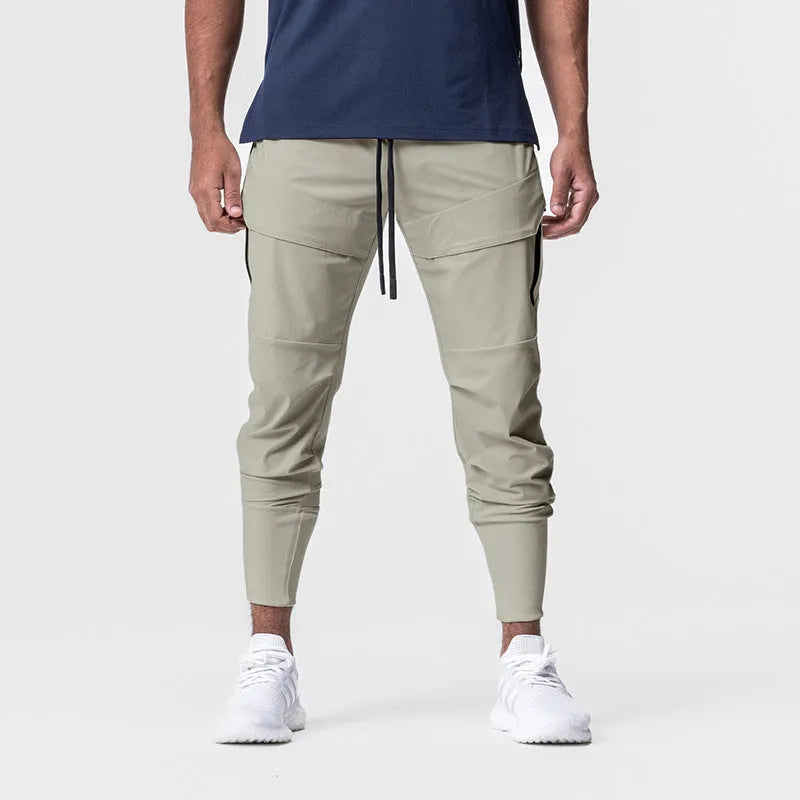 Men's solid colour polyester jogger pants in black, mid-waist style, casual sports trousers