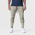 Men's solid colour polyester jogger pants in black, mid-waist style, casual sports trousers
