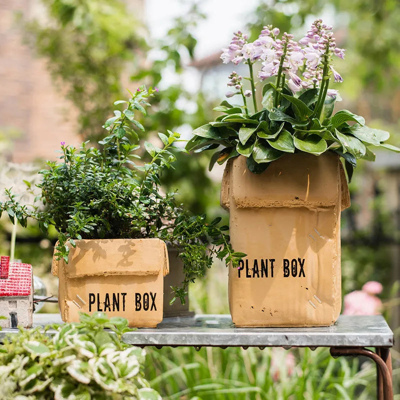 Cement flowerpot with perforated base and Nordic brown paper box design