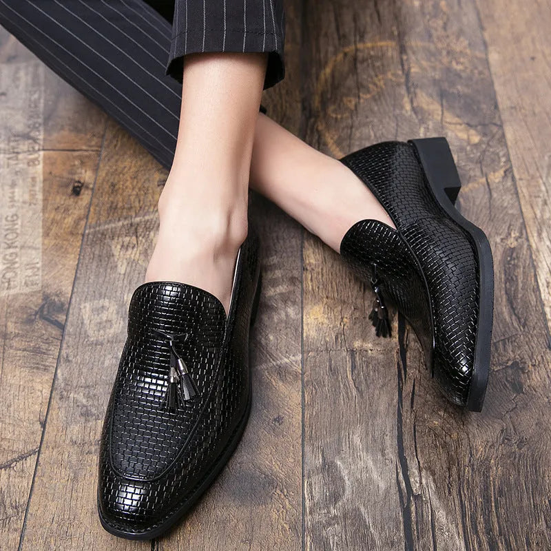 Men's black slip on loafers with pointed toe and tassel detail on PU leather upper