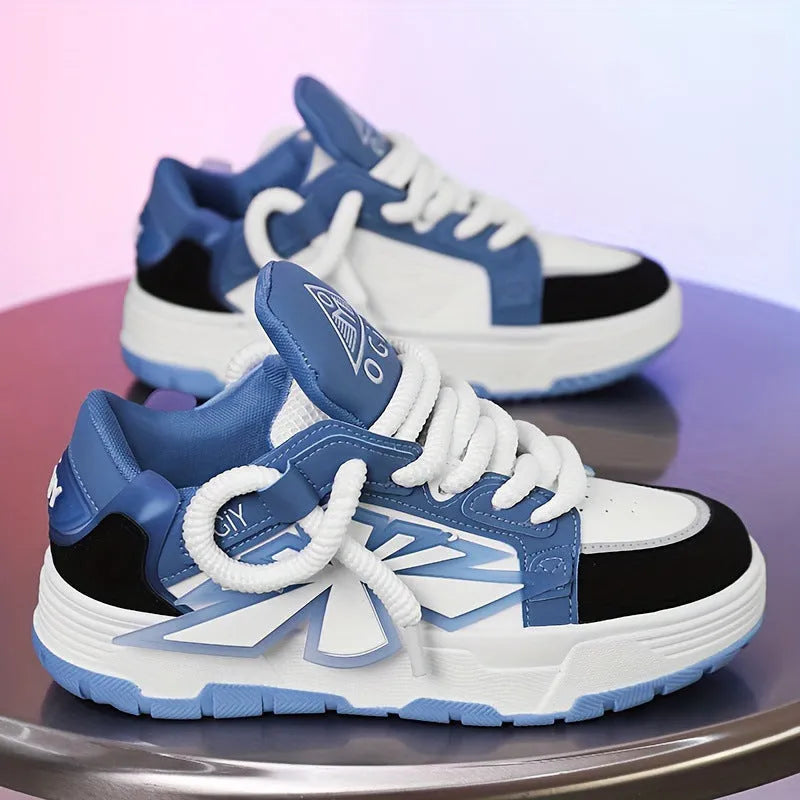 Men's white clunky casual sneakers with cartoon totem pattern, round toe, and lace-up front on a rubber sole.