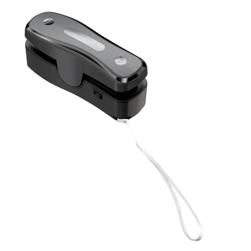 Milky white portable kitchen sealer with USB charging cable and compact dimensions
