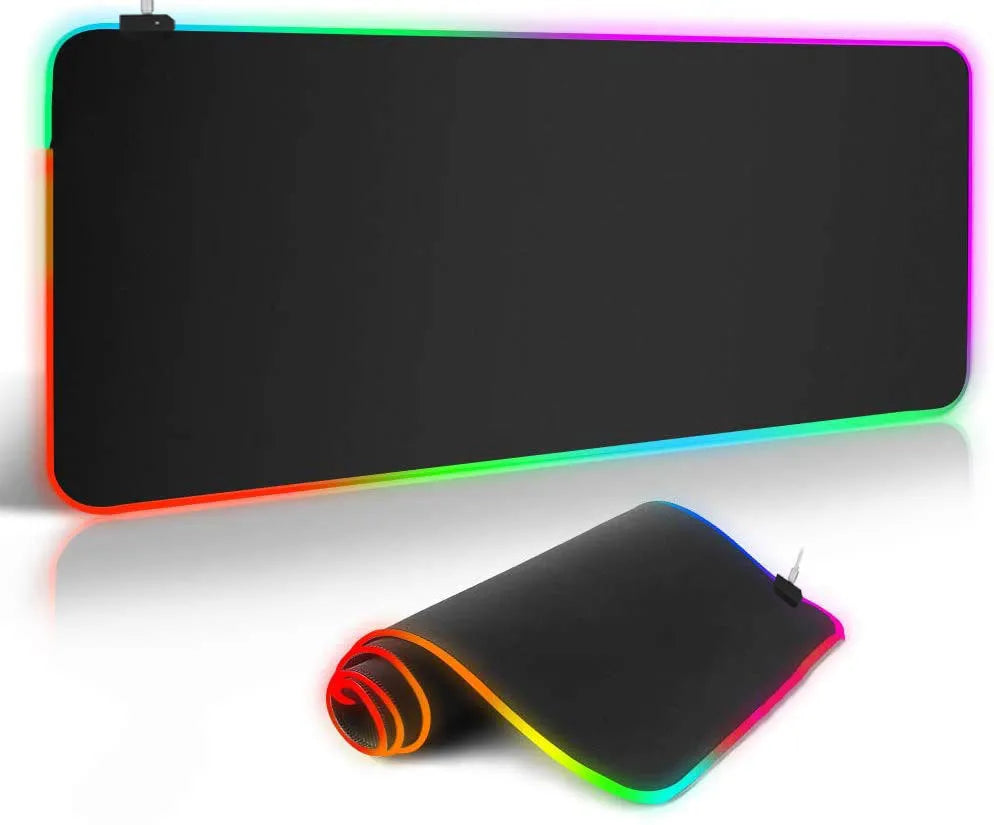 Starry sky pattern RGB luminous gaming mouse pad with USB cable on a desk