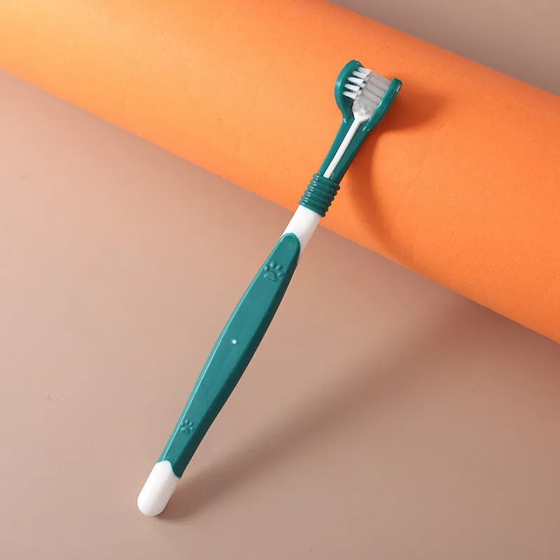 Pet toothbrush with nylon bristles and plastic handle in green colour