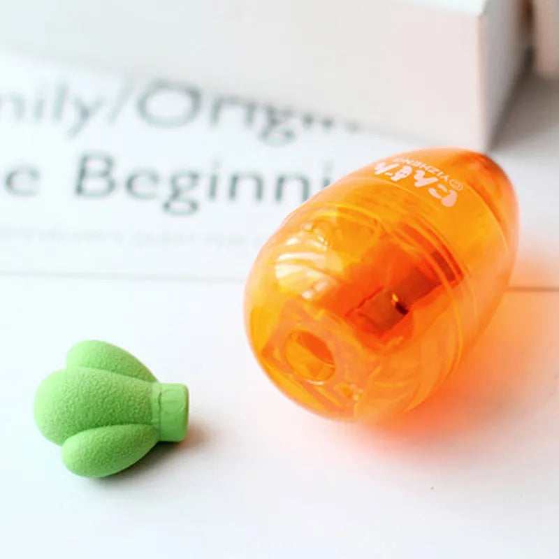 Carrot-shaped plastic pencil sharpener with 7cm handle in carrot colour