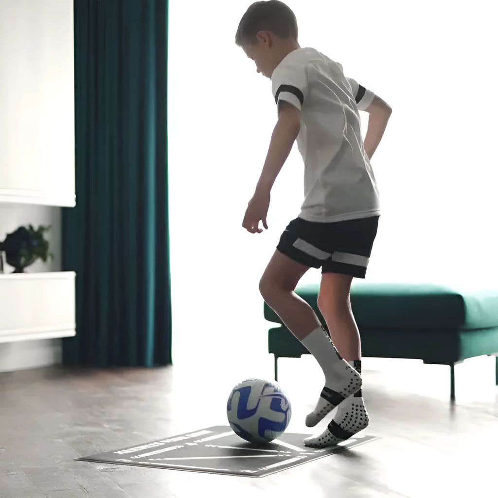 Black non-slip football training mat measuring 60 by 90 centimetres