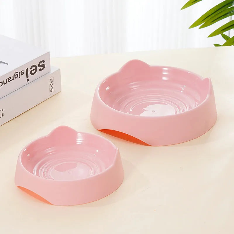 Ceramic dog slow feeder bowl with puzzle maze design in blue, green and pink colours showing S and L size options