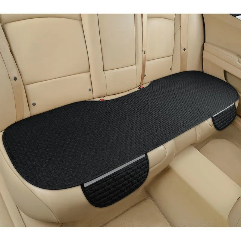 Linen car seat cushion with hemmed edge in charm coffee colour, shown on a car seat.