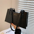 Small square PU handbag with crocodile pattern, sewing line detail, medium hard build, 27x16x7cm, black colour