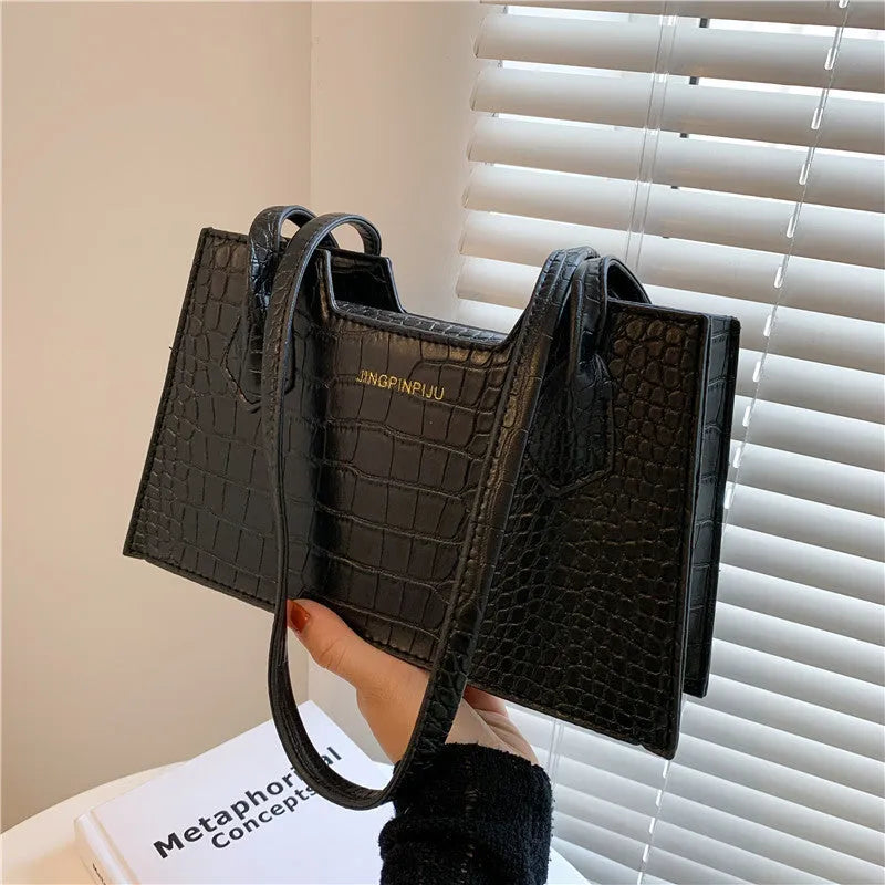 Small square PU handbag with crocodile pattern, sewing line detail, medium hard build, 27x16x7cm, black colour