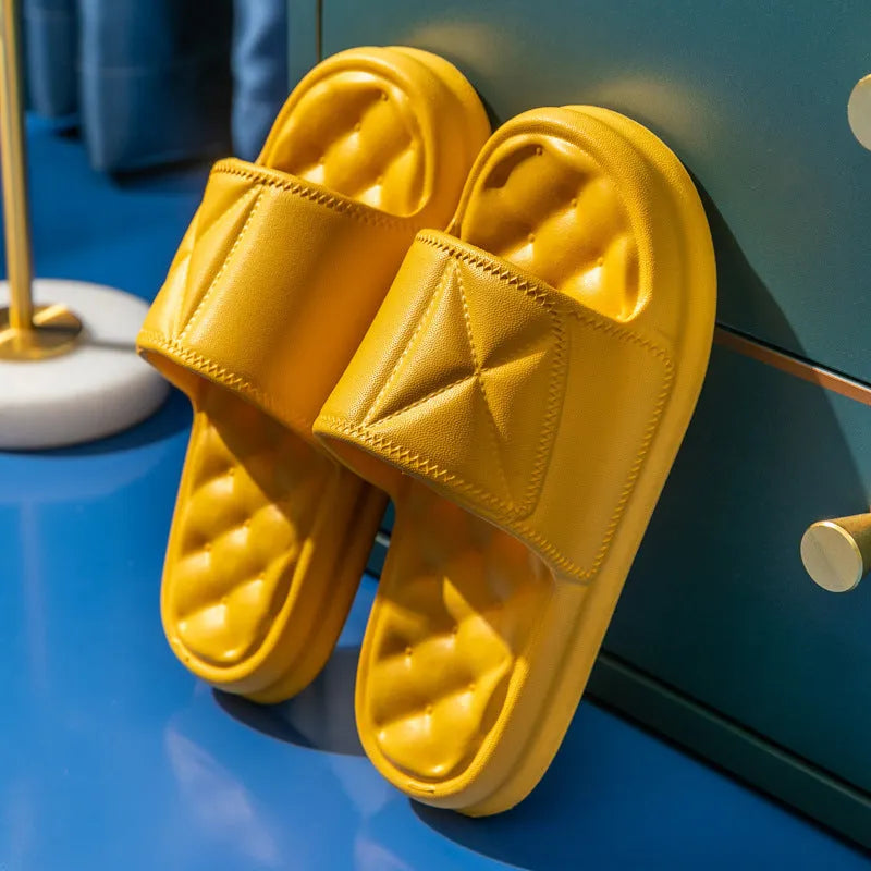 Pair of soft EVA non-slip bathroom slippers with a thick sole, shown in a choice of colours.