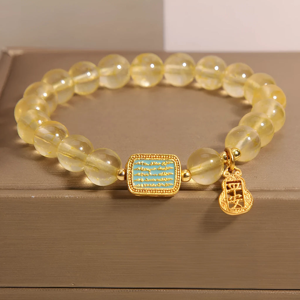 Women's yellow citrine crystal bracelet with rhinestone decorations on wrist