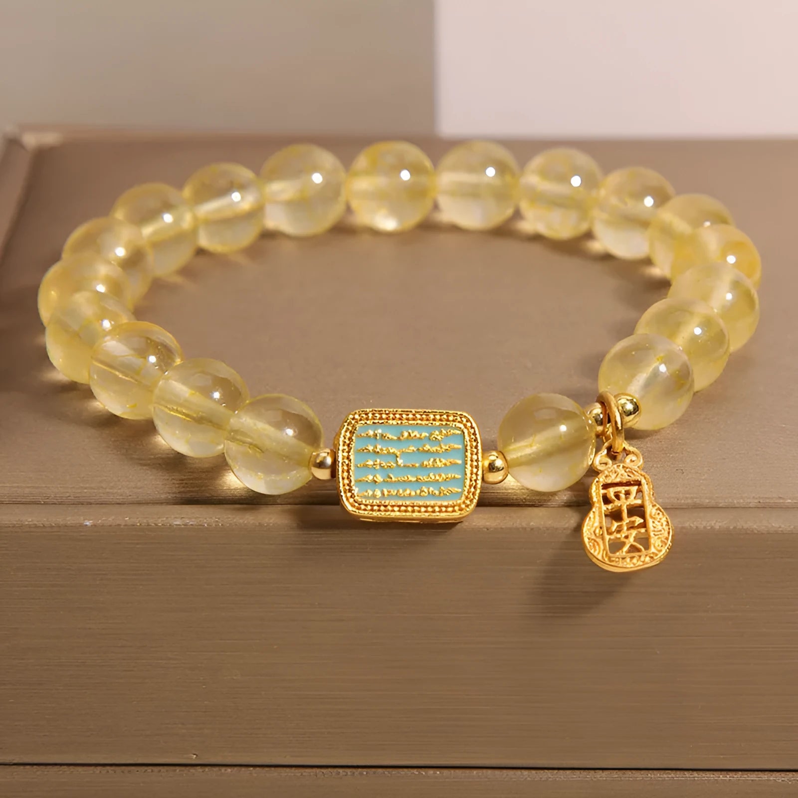 Women's yellow citrine crystal bracelet with rhinestone decorations on wrist