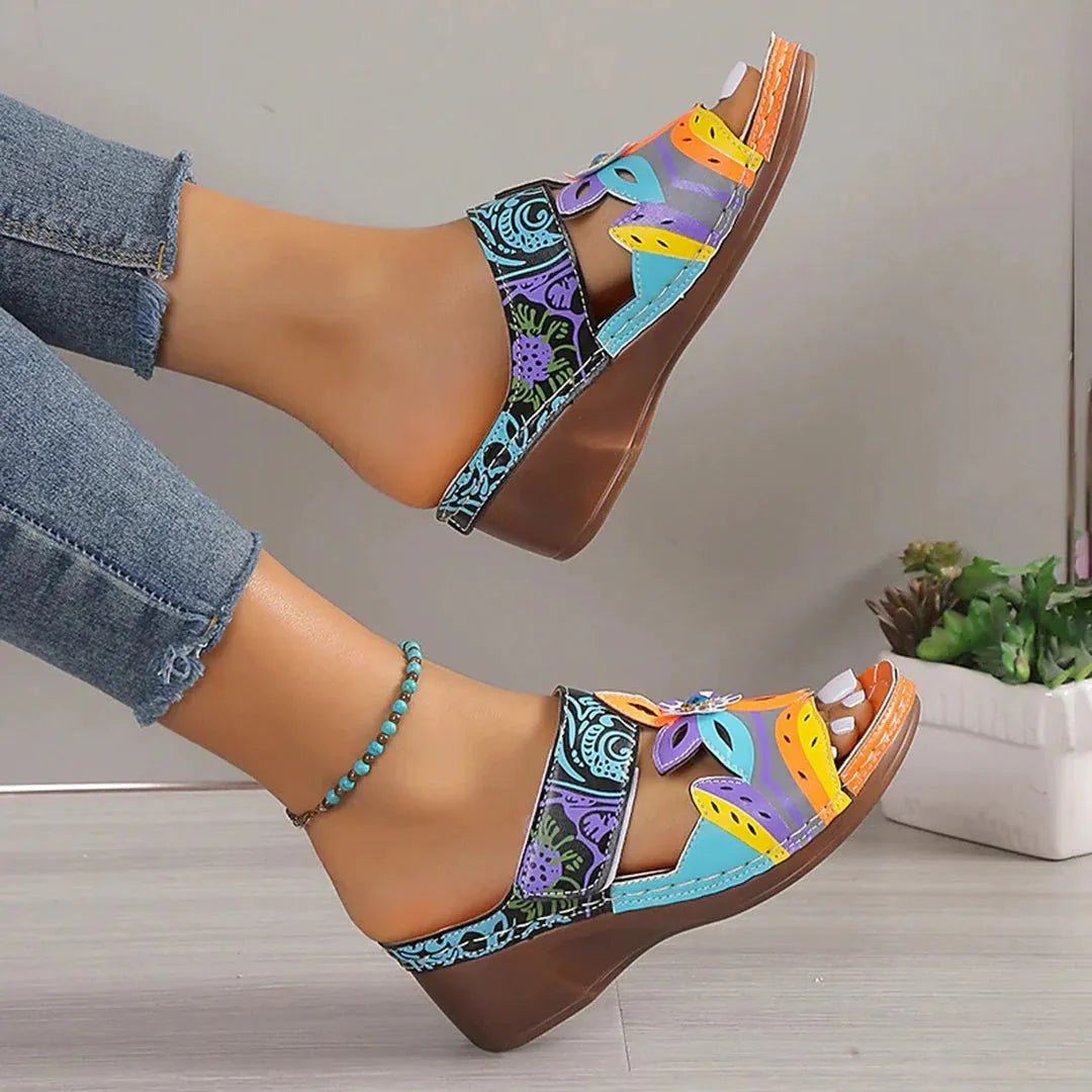 Ethnic totem patterned slippers in cowhide with a coloured slope design and rubber sole.