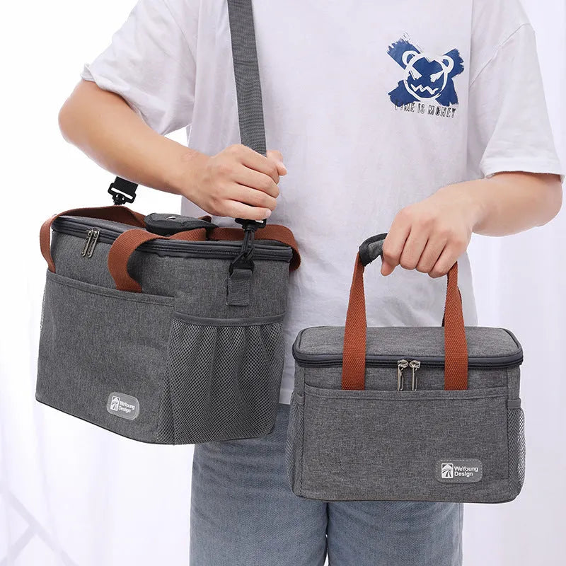 Insulated crossbody picnic bag in Oxford cloth with shoulder strap, shown in grey colour