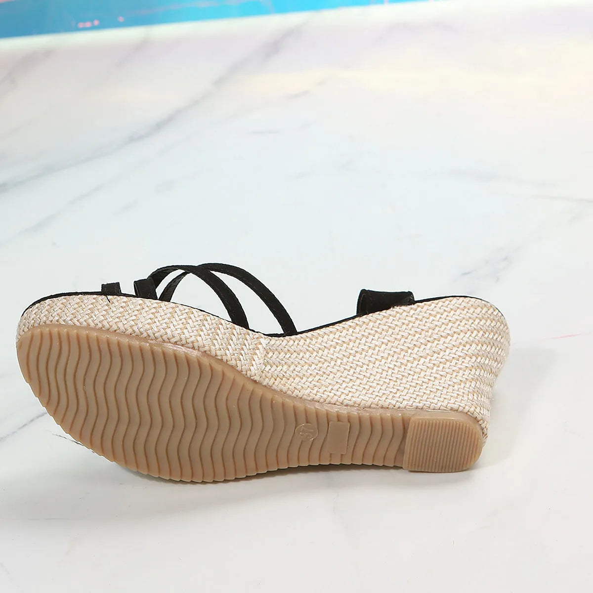 Women's simple wedge sandals with fish mouth toe in black and milky white on a neutral background.