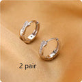 Geometric round copper earclip earrings with hemp rope interwoven design in gold colour