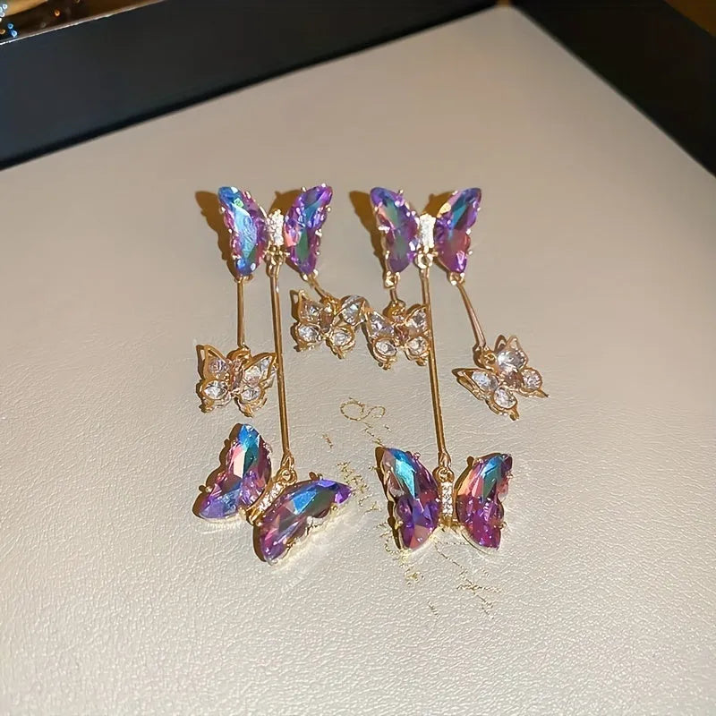 Silver needle crystal flowers butterfly tassel earrings with blue purple motifs and electroplated alloy construction