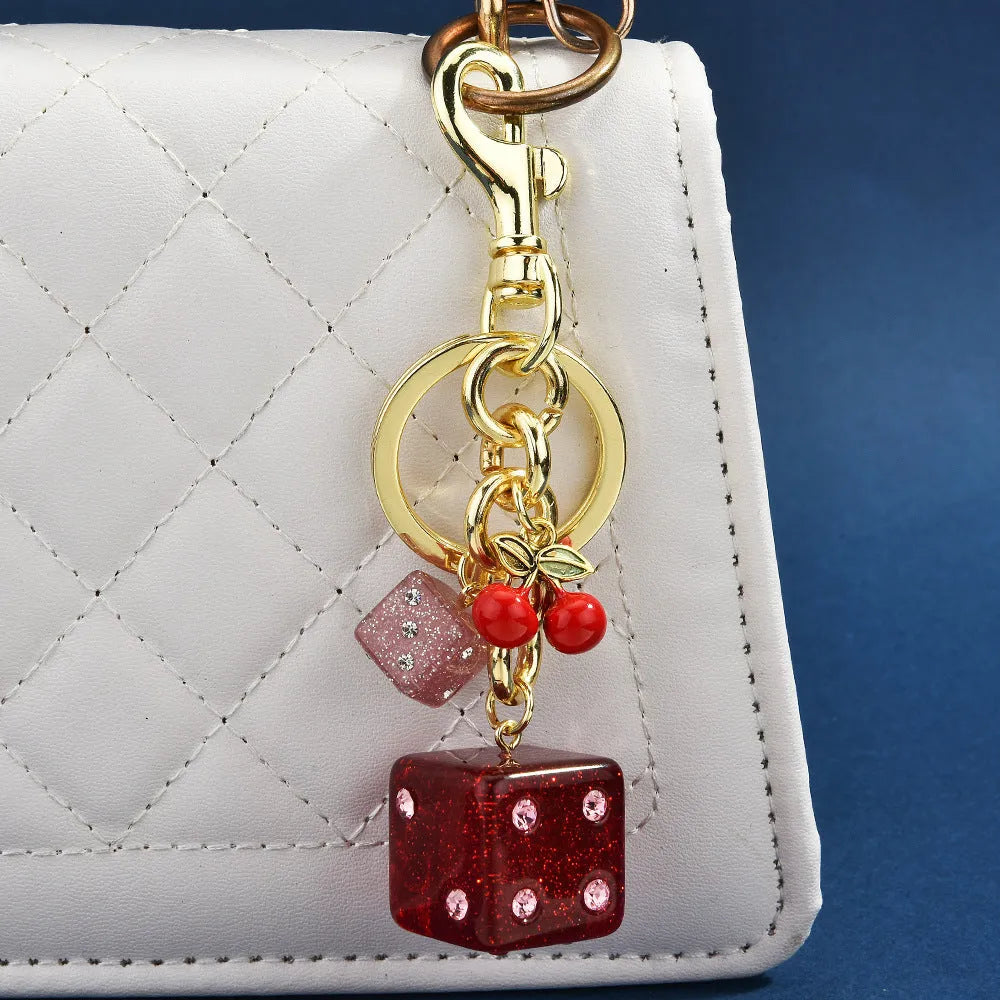 Metal hanging dice keychain pendant in cherry two-tone colour, square shape, vintage style