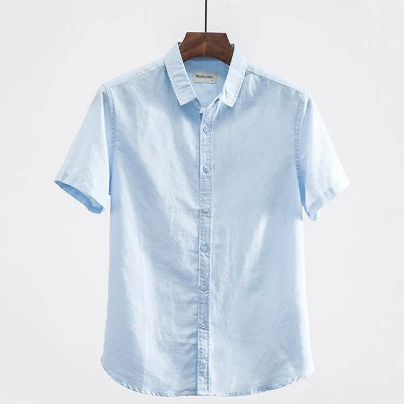 Men's light blue linen short sleeve shirt with a square collar on a hanger.