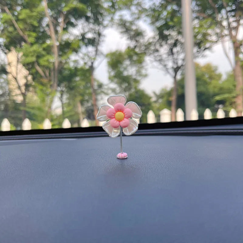 Cute plastic swing car decoration in blue, showing approximate 5cm height.