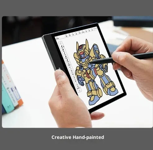 7-inch black colour E-ink e-book reader with capacitive stylus on a desk showing a colour book page