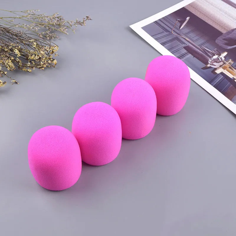 Four multicoloured foam microphone windshields for ball-shaped handheld stage microphones