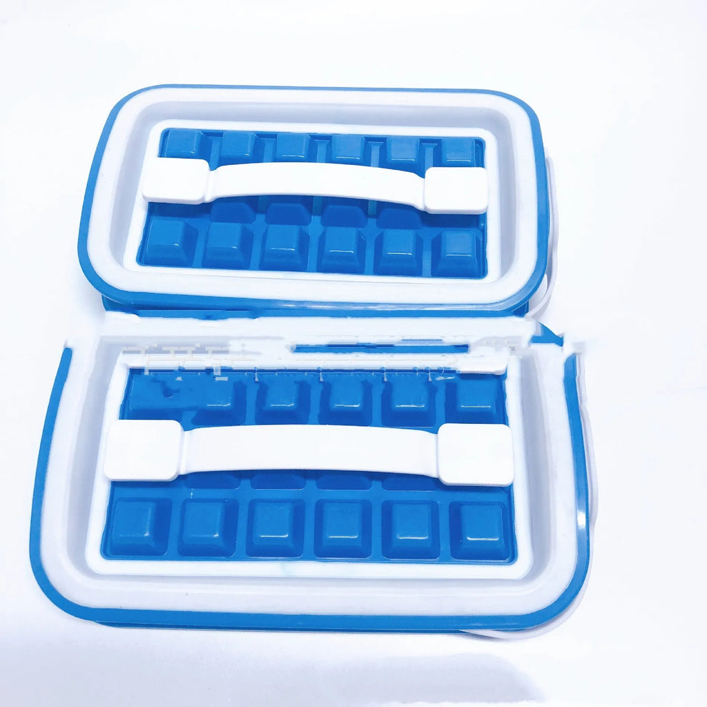 Blue silicone ice cube tray with 36 square cavities and a lid on a wooden table