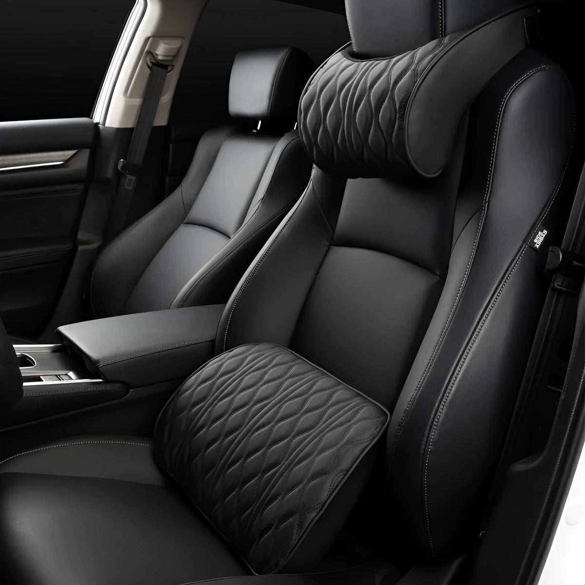 Memory foam car headrest and waist rest set in black leather and knitted fabric on a car seat
