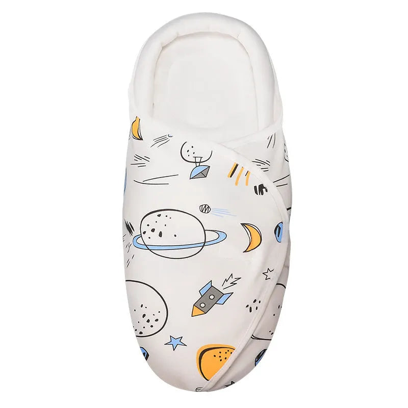Pure cotton baby swaddle in a dinosaur print, shown laid flat at 30 by 60 cm.