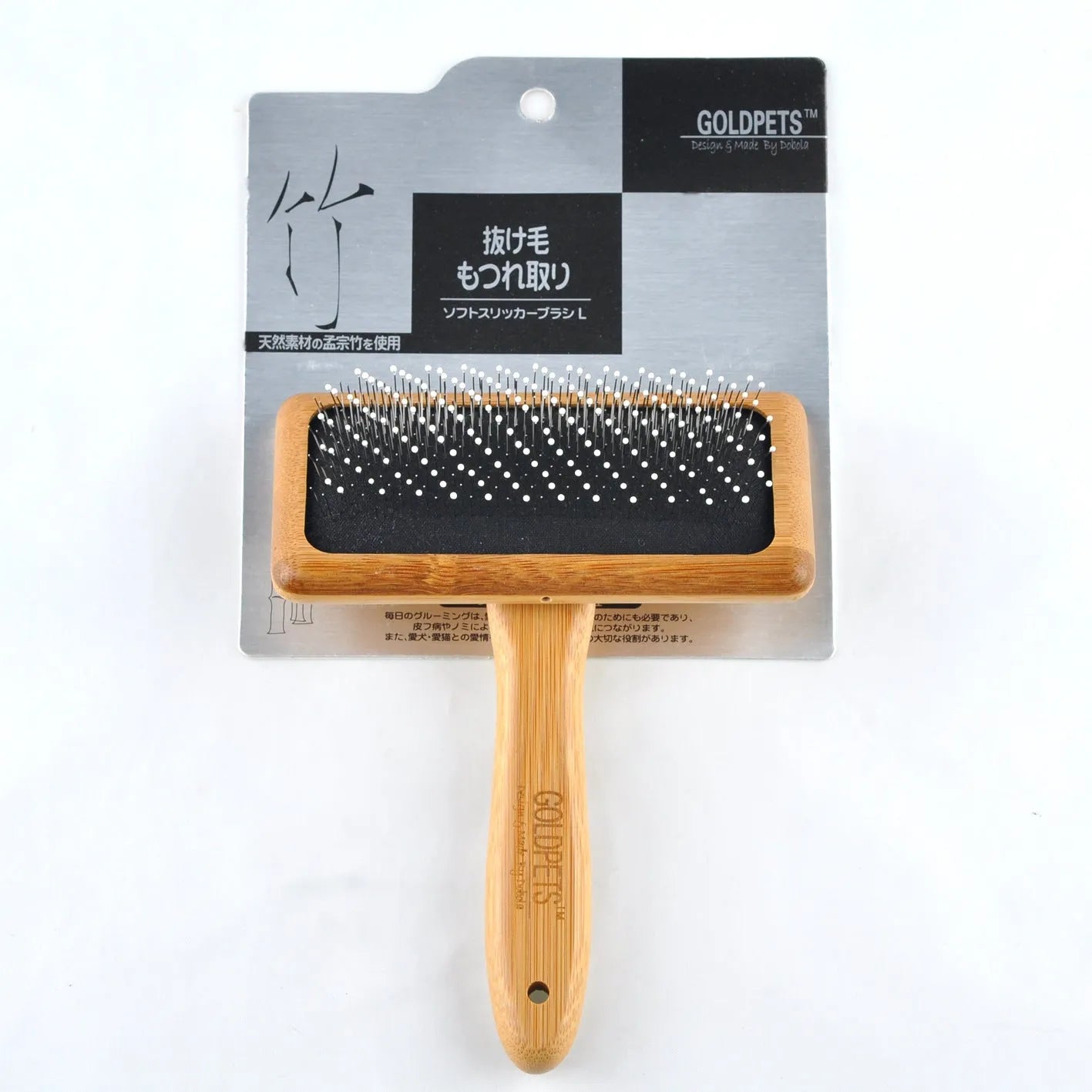 Pet grooming bamboo wood air cushion needle comb with original bamboo colour handle and steel pins on a clean background