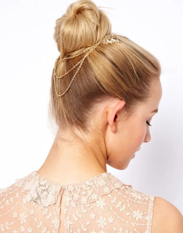 Gold leaf chain tassel hair comb on dark background, alloy plated finish