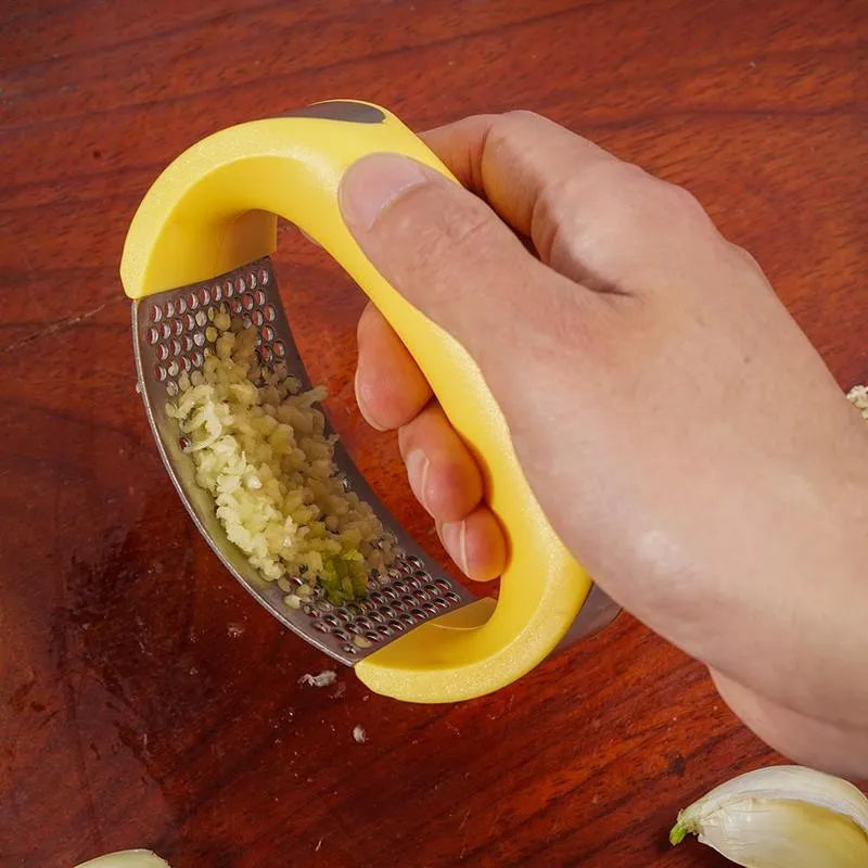 Stainless steel garlic masher press with ergonomic handle and non-slip grip