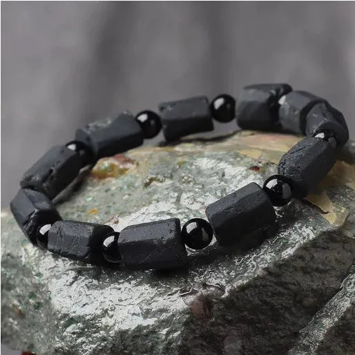 Black tourmaline rough stone bracelet with natural textured beads measuring 8.5-9mm and adjustable closure