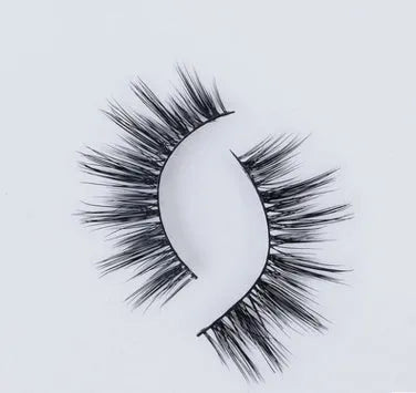 Pair of faux mink eyelashes with long tail and cotton stem against white background