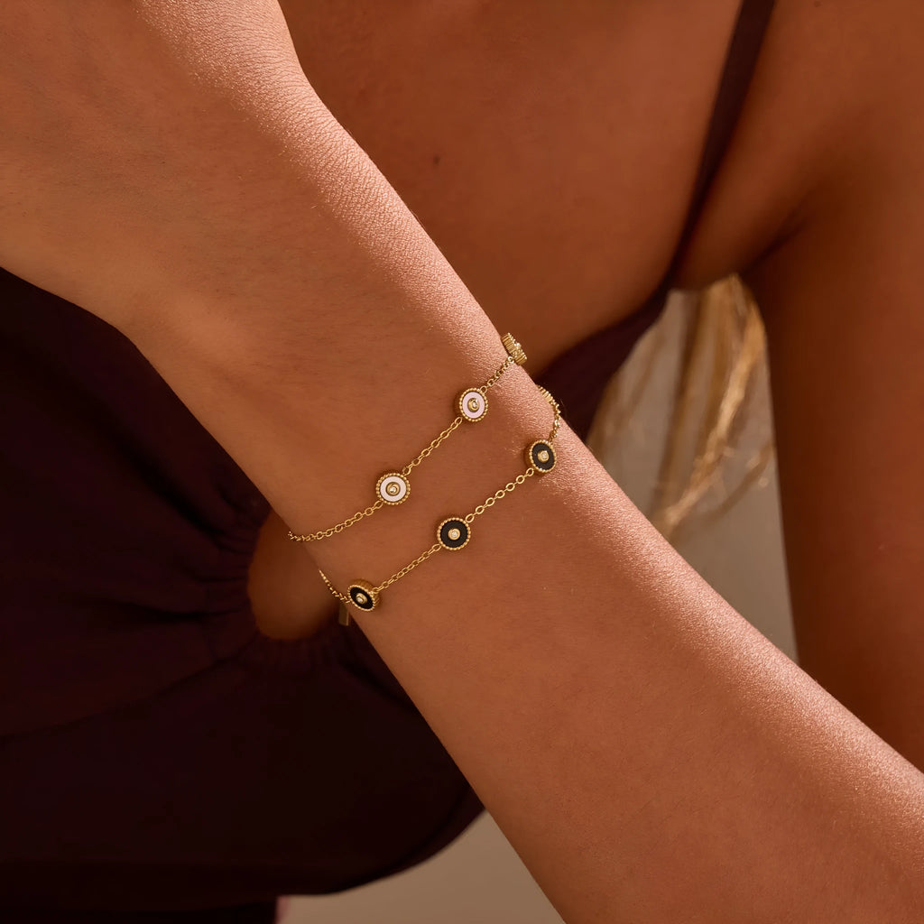 Women's stainless steel bracelet with 18K gold plating and geometric fritillary charm, includes matching necklace