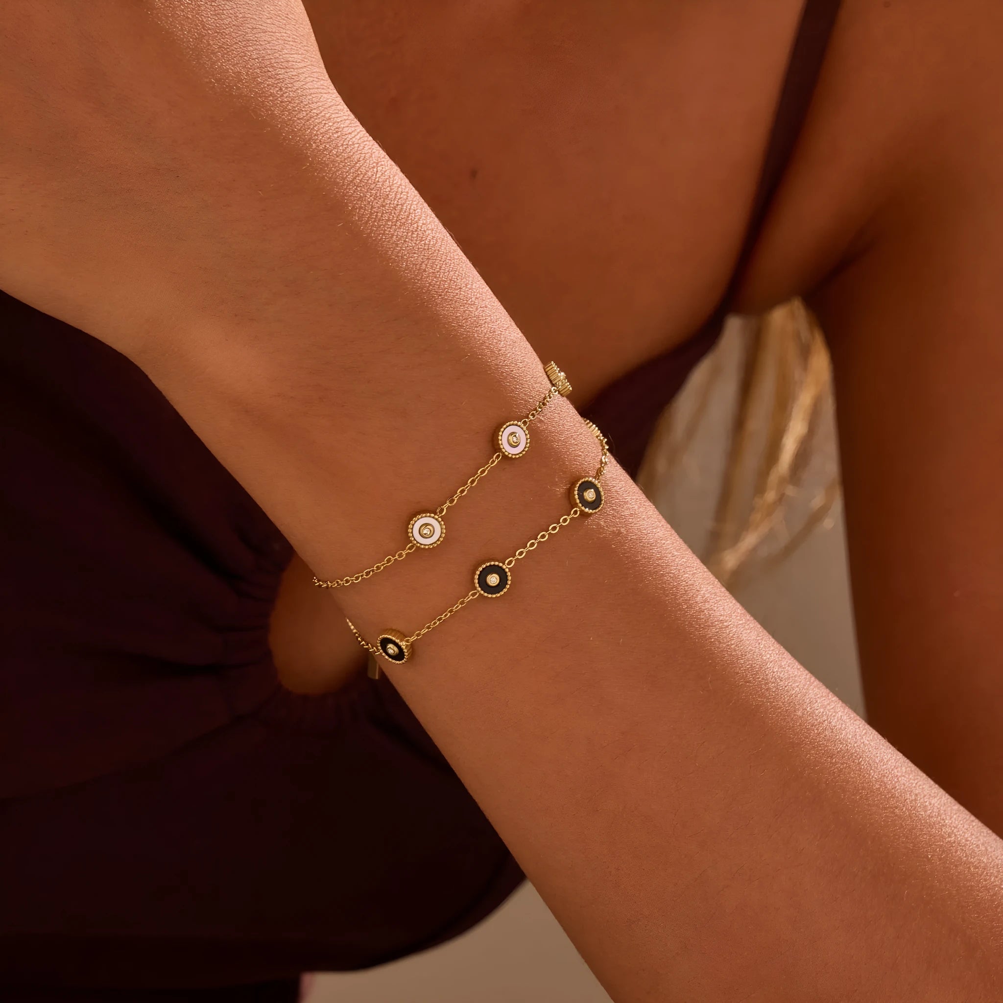 Women's stainless steel bracelet with 18K gold plating and geometric fritillary charm, includes matching necklace