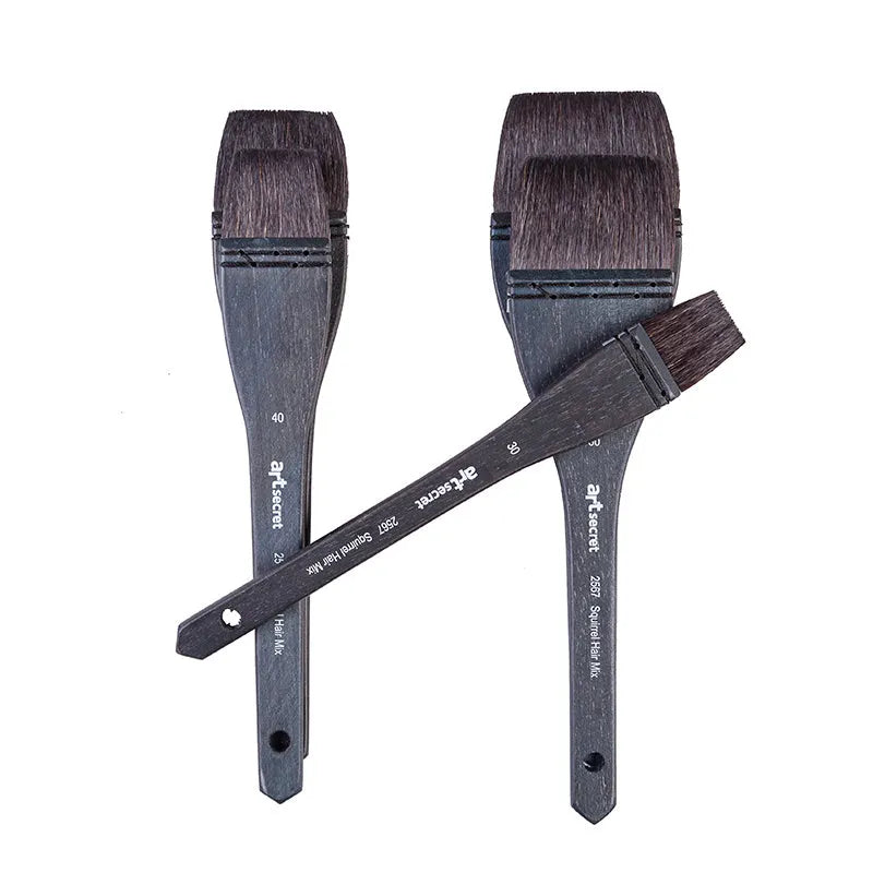 Grey squirrel hair artist paint brush with a light wood handle on a white background