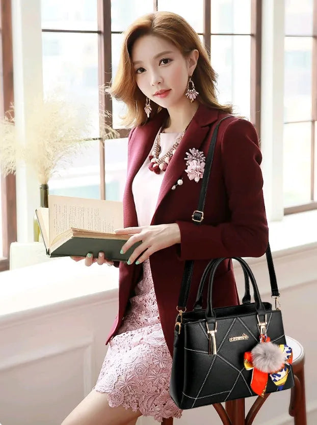 Ladies PU messenger bag with embroidery detail and soft handle in cross-section square shape
