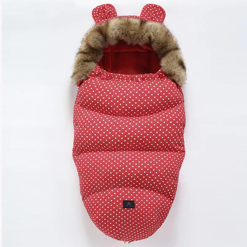 Convertible baby sleeping bag cocoon in a pram, showing cotton blend fabric and flannel lining.