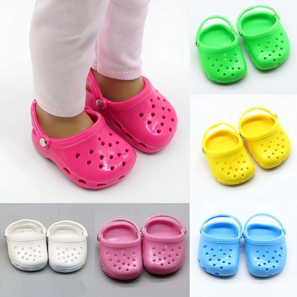 A pair of small plastic doll beach slippers in blue, red, yellow, or green colours.
