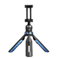 Black plastic and aluminium desktop tripod holding a mobile phone for video calls.