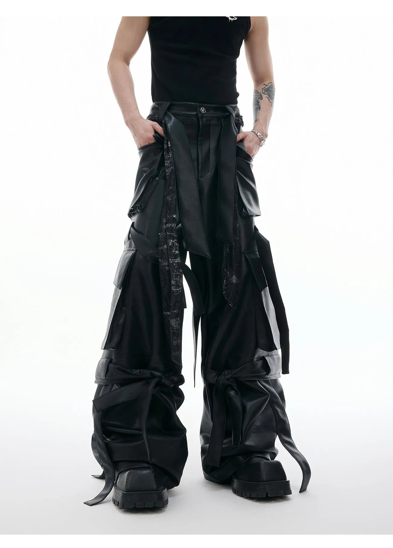 Black quilted leather pants with multiple pockets and ribbon stitching detail