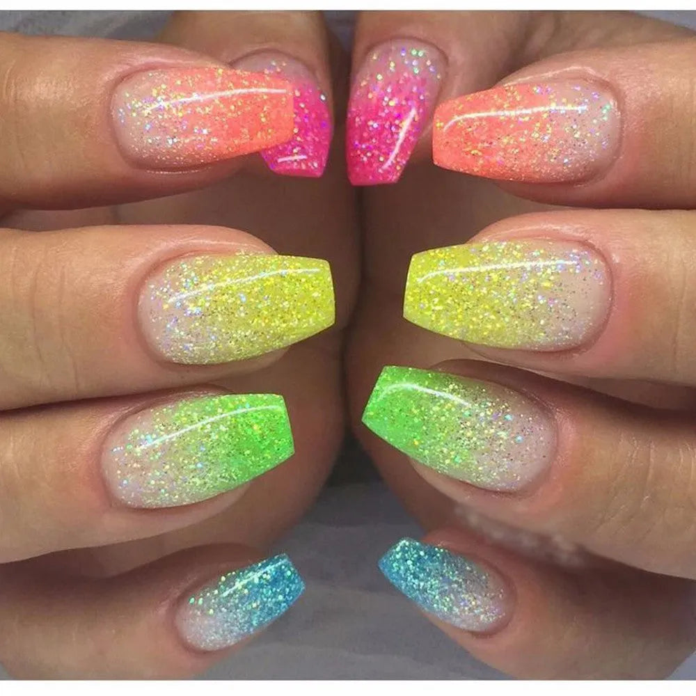 Six 1g pots of neon nail glitter powder in blue, green, orange, pink, purple, and yellow colours on a white background