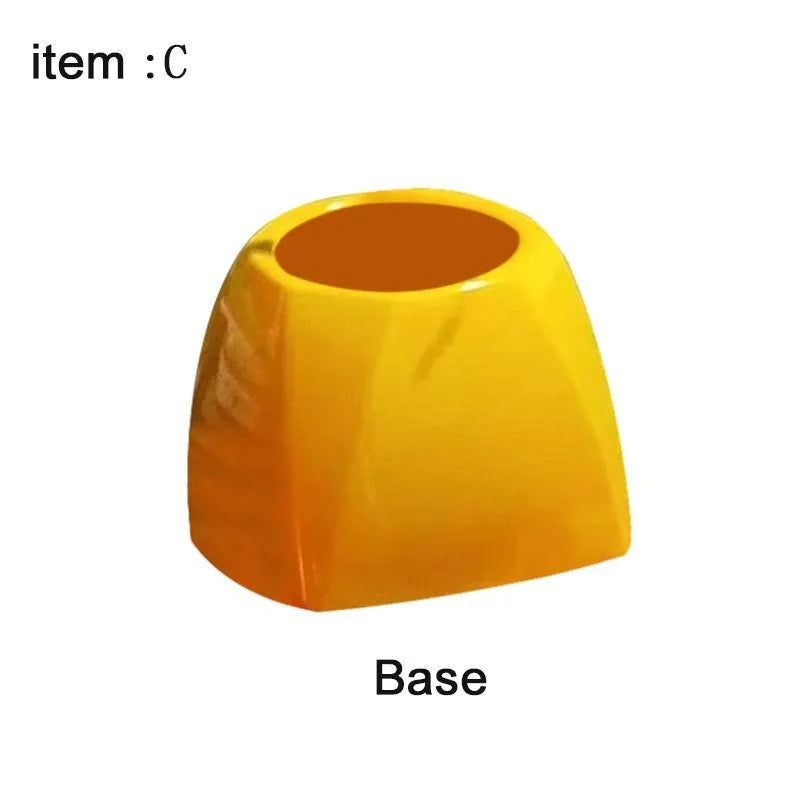 Yellow plastic Donald Trump toilet brush with hanging slot on handle.