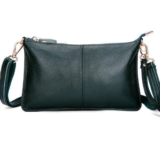 Lady's cowhide leather slant bag in apricot colour with hand strap and shoulder strap showing zipper compartments