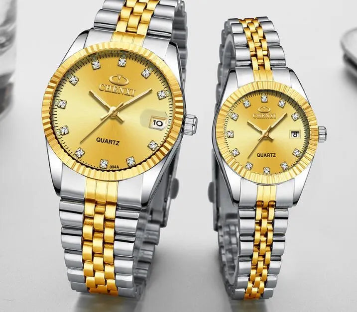 Gold men's quartz wristwatch with stainless steel strap and mineral glass display on a white surface