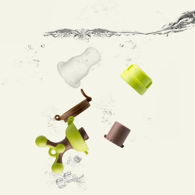 Green polypropylene baby bite trainer with textured surfaces for infant teething relief