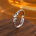 Open ring for women in retro silver with a detailed heart shape design on a copper base.